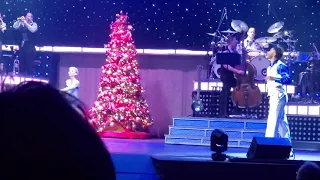 Gary singing Blue Christmas with aerialist LeAnn and Simone