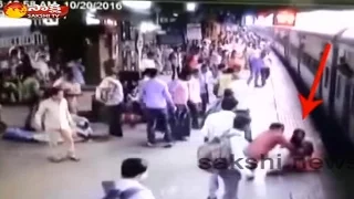 Woman falls from train at Thane || Miracle escape