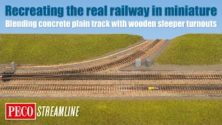 The realistic railway: blending concrete plain track with wooden sleeper turnouts.