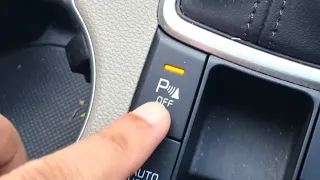 How to turn on or off reverse parking sensors in Kia Sportage