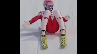 Stefan Kraft touching the snow by his suit