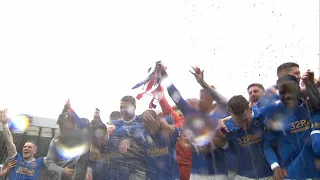 Rangers celebrate with the Scottish Cup trophy on Hampden pitch