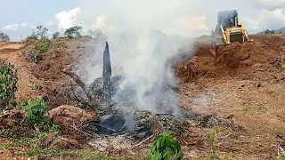 Extremely Dangerous Work, Operator Bulldozer Pushing Dirt Soil in Risky Mountain..