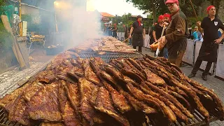 Italy Street Food. Melted Cheese on Pretzel, Huge Grill of Ribs, Pork Meat for Sandwich, more Food