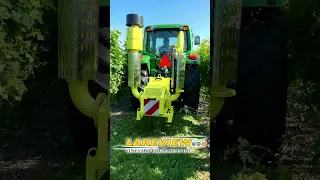 John Deere 6430 working with Collard E2200F MAX Leaf Remover in Vineyards