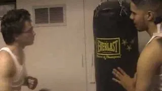 Gay guy hits punching bag