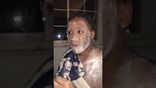 african man eating chocolate for the first time