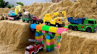 Construction vehicle rescue bridge with dump truck and crane truck toys