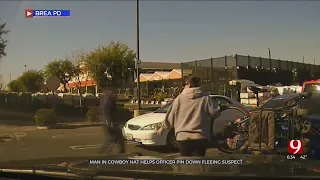 Man In Cowboy Hat Helps Officer Pin Down Fleeing Suspect