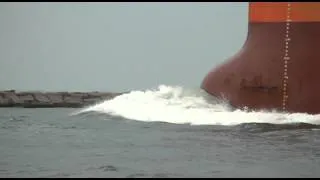 Dolphins swimming in front of ship at Port Aransas