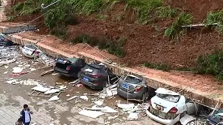 Collapsed Wall Destroys 10 Cars