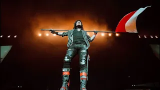 Nikki Sixx with flag and message to Polish fans in concert Krakow Tauron Arena Mötley Crüe 2023 Live