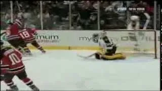 Unlucky Bounce: Tim Thomas tries to sweep puck away and misses