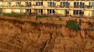 Raw: Drone Video of Evacuated Cliff-Top Apts.