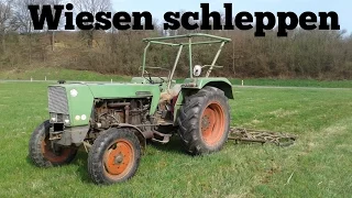 Wiesen schleppen mit einem Fendt Farmer 3s