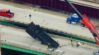 Driver rescued after truck goes off Indiana bridge, catches fire