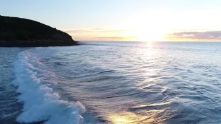 Sunset over Whale Bay and Indicators, Raglan NZ :: aerial drone