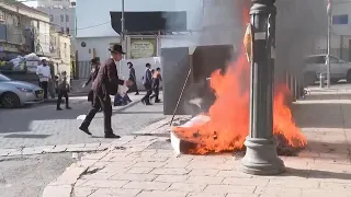 Ultra-Orthodox Jews burn bread on street fires on Passover Eve in Jerusalem