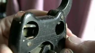 Demo of an antique cutaway Miller padlock.