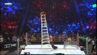 ‪Rey Mysterio throws Alberto Del Rio off a Ladder throught a Table‬‏ WweArab Com