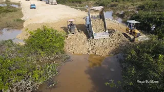 Amazing Road building Across Forest mighty machines bulldozer pushing rock and Dirt Truck unloading