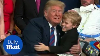 Young boy tries multiple times to give Trump a hug