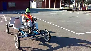 Four person quadricycle with electric assist.