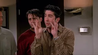 FRIENDS - JOEY IS LAUGHING AND HIDING BEHIND ROSS