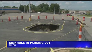 Large sinkhole opens up in Howland parking lot