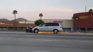 Van Driver Hits Motorcycle and Drags it Along on Highway