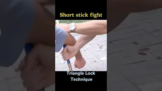 Short stick fighting skill：Lock his arm so he can't move.