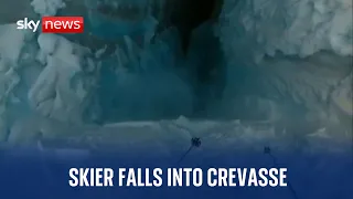 Watch the terrifying moment a skier falls into a crevasse in France