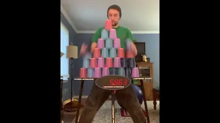 Guy Makes Pyramid of Multiple Plastic Cups and Stacks Them Back in Pile Under 9 seconds - 1171029-1