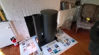 Uncle Mud Installing a Liberator Rocket Mass Heater in a Fireplace