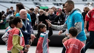 At the Stade de France, Mbappé plays with sick and disabled children