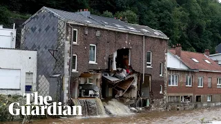 Belgian news crew capture moment flooded house partially collapses