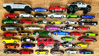 Box full of various miniature cars Peugeot, Volvo, Renault, Hyundai, Pagani, Cadillac One, DHL 21