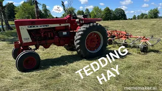 Tedding hay with the 806