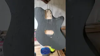 grain filler applied to guitar body