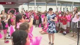 Flash mob welcomes back teacher battling cancer