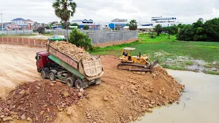 Wonderful Show Land fill up Processing Dump Truck With Dozer  push soil  into water clear land EP002