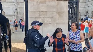 Police warn tourist not to touch the  guard or the horse after guard shouts stand clear #kingsguard