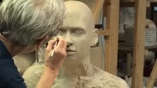 Tip Toland sculpting a bust at Seward Park Clay Studio