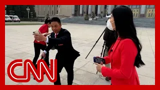 Member of Chinese parliament runs from CNN's questions