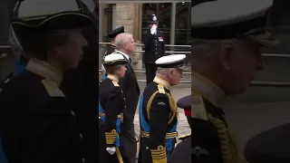 Members of the Royal Family walk behind the Queen's coffin