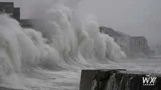 Massive waves crash over homes