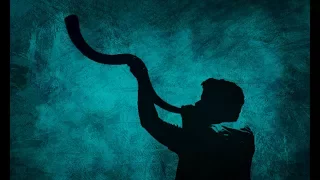 Trumpet sounds, a shofar piercing the darkness.