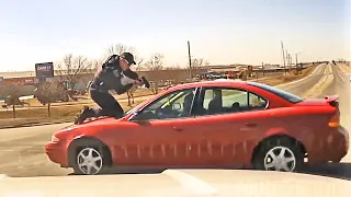 Traffic Stop Ends With Driver Speeding Off With Cop On Top Of Car Hood