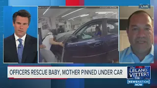 OFFICERS RESCUE BABY, MOTHER PINNED UNDER CAR