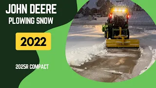 John Deere 2025R Plowing Snow with Rear Blade in Warm Cab